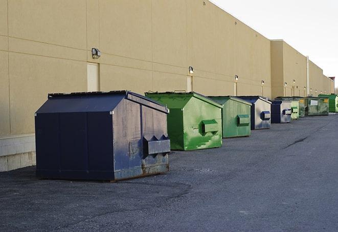 an assortment of sturdy and reliable waste containers near a construction area in New Albany